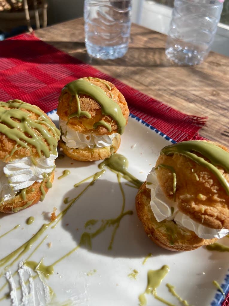Matcha choux pastries filled with whipped cream
